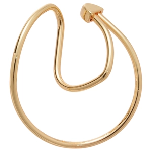 Irregular twisted gold metal ear cuff with geometric detail on white background