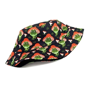 Unisex black bucket hat featuring cartoon frog and mushroom print for outdoor sun protection