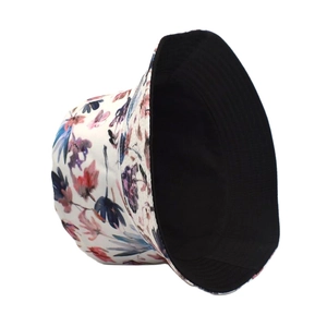 Detail of reversible sun hat showing colorful floral print side and black lining fabric