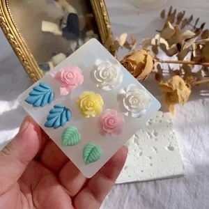 DIY silicone mold for flower and leaf resin charms with pink and yellow rose designs