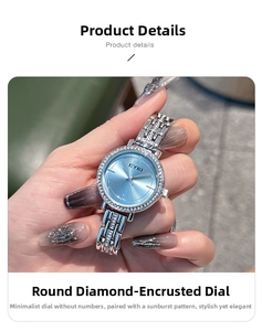 Detail of silver ladies watch featuring a blue sunray dial and rhinestone-studded bezel