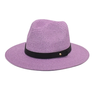 Detail of purple paper straw fedora hat featuring woven texture and black band with gold buckle