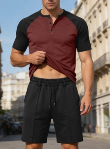 Detail of burgundy patchwork Henley shirt and black shorts with breathable mesh texture
