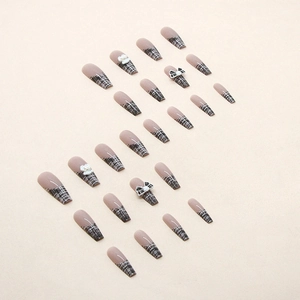 Pink coffin press-on nails with tweed pattern and delicate black and white 3D bows