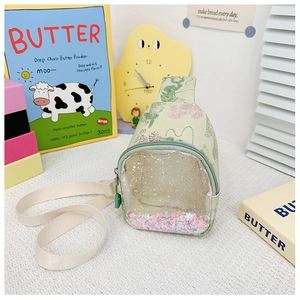 Detail of green kids crossbody bag with transparent PVC pocket and quicksand sequins