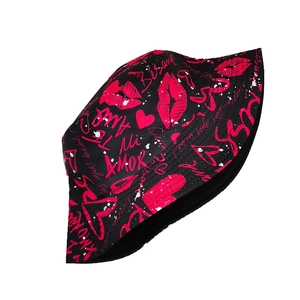 Detail of black cotton bucket hat with pink graffiti heart and lip kiss prints