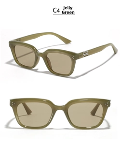Detail of vintage square jelly green sunglasses frame with stylish silver metal hinges