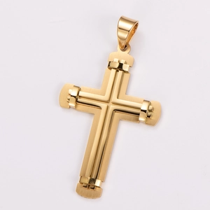 Macro detail of two-tone gold cross pendant with polished and brushed metal finish