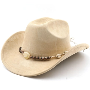 Detail of beige suede cowboy hat featuring ethnic beaded band and shell accessory