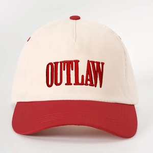 Retro two-tone baseball cap in cream and red with OUTLAW embroidery and adjustable strap