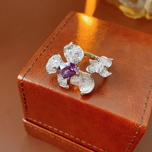 Detailed view of luxury purple flower ring with zircon stones on leather jewelry box