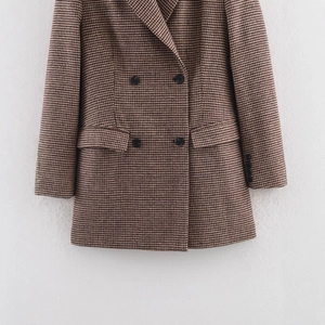 Classic mid-length houndstooth blazer for women featuring a double-breasted front and pockets