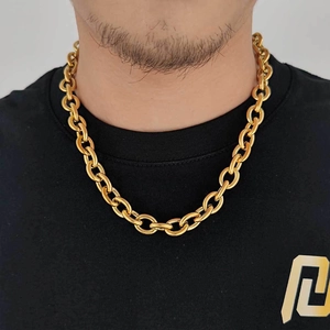 Detailed view of 12mm golden stainless steel chain necklace worn by a male model