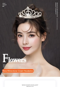 Detailed view of an elegant silver rhinestone crown worn on a professional bridal hairstyle