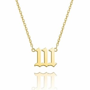 Gothic number 111 pendant on thin 14K gold stainless steel chain over white background