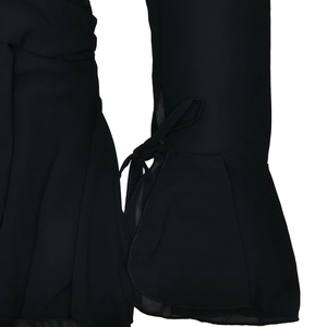 Detail of black chiffon sleeve with delicate tie-up design and light fabric texture