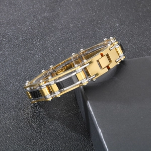 Close-up of industrial multi-tone steel bracelet with carbon fiber on matte black steps