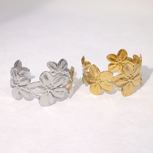 Vintage floral open bangle in gold and silver finish with detailed petal texture