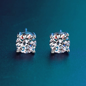 Macro shot of 925 silver stud earrings with sparkling D color moissanite in four-prong setting