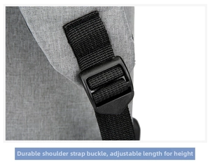 Detail of adjustable backpack shoulder strap with a sturdy plastic buckle and grey fabric