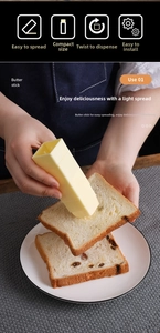 Close-up of rotary butter stick applicator spreading butter on toast in a kitchen setting