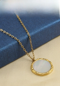 Close-up of 18k gold plated stainless steel necklace featuring a white shell pendant