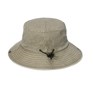 Detail of washed cotton sun hat featuring metal eyelets and adjustable chin strap