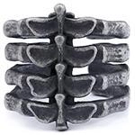 Close-up of vintage gothic rib cage ring in oxidized silver finish with open band