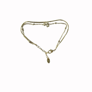 18K gold plated double layer bracelet featuring a zircon flower pendant on a white background