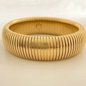 Polished gold stainless steel Tubogas stretch bracelet for women with ribbed texture