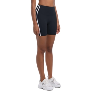 Close-up of black high-waisted yoga shorts with side double white stripes and wide waistband