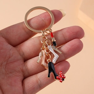 Golden alloy keychain with enamel lipstick and high-heeled shoe charms with rhinestones