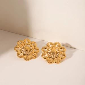 Boucles d'oreilles vintage françaises en acier doré en forme de tournesol évidé