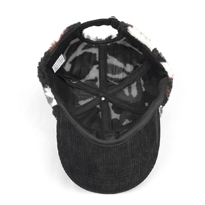 Detail view of winter baseball cap interior showing mesh lining and polyester wash label