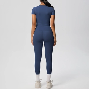 Rear view of deep blue moisture-wicking yoga set showing body-hugging fit and seams