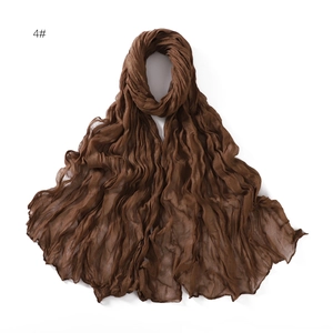 Detail shot of breathable dark coffee pleated cotton linen scarf with fine texture