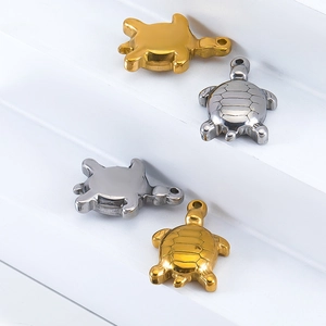 Sea turtle pendants in gold and silver stainless steel showing front and back views