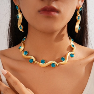 Luxury gold sweater necklace and earrings set with wavy blue gemstone design for women