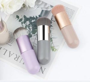 Chubby round makeup brushes in pastel colors shown with soft fiber bristles and matte handles