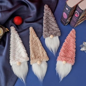 Chirstmas plush gnomes set in four colors on dark blue silk background with festive decor