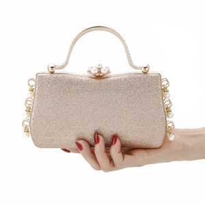 Elegant gold sequin evening clutch bag with pearl rhinestone clasp and side beaded details