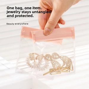 Pink zip lock EVA jewelry pouches showing earrings inside for dust-proof storage