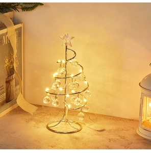 Detail of spiral metal Christmas tree with LED crystal bulbs for festive table decor