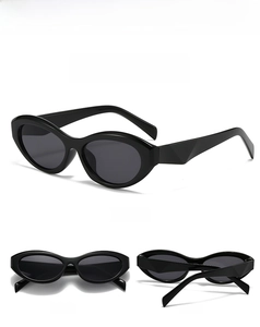 Detail view of oval cat-eye sunglasses with thick black frames and geometric temples