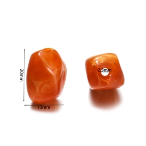 Detail view of orange acrylic irregular beads with size specs 20x13mm for DIY crafting
