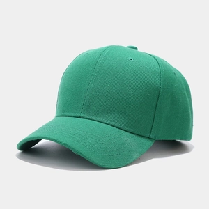 Detailed texture of green cotton twill baseball cap with reinforced stitching