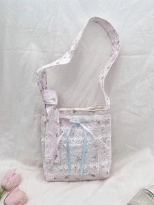 Pink floral canvas crossbody bag with white lace details and sweet blue ribbon bow