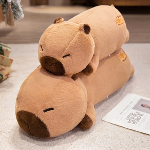 Cute soft capybara plush long pillow set with orange embroidery on fluffy carpet