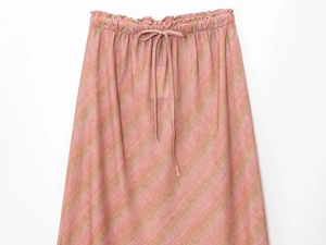 Detail of pink and khaki striped linen midi skirt featuring elastic waist and drawstring