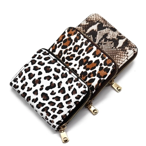Three-piece leopard and snake print accordion card holder wallets with gold zippers